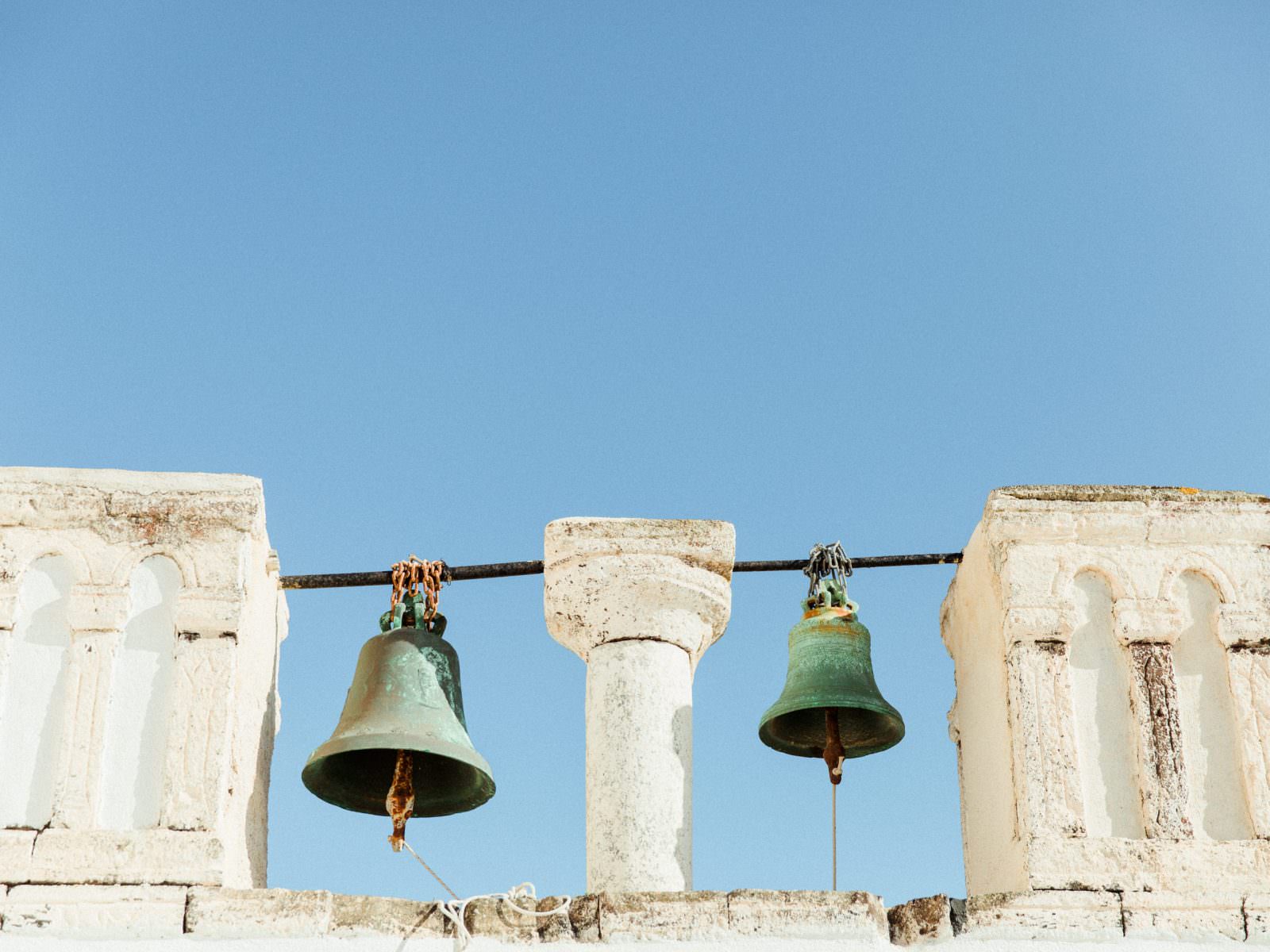 Elopement in Santorini church bells and blue Skys